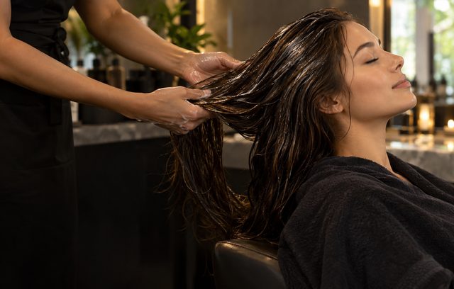 Deep conditioning hair treatment being applied to long hair at Saiba Hair Salon & Spa